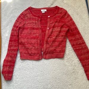 Its a dressy sweater color red for a former dance graduation or party